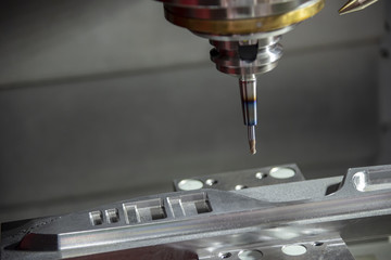 The CNC milling machine cutting the  automotive mold part with the solid ball endmill tool. Modern...