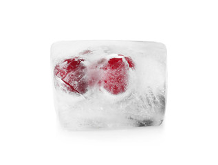 Raw berries frozen in ice cube on white background