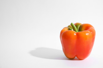 Raw ripe paprika pepper on white background