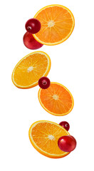 Orange slices, whole cherry and cranberries in the fall isolated on white background. Mix of fruit juice