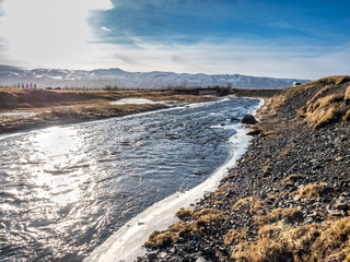 Frozen water in river near Gluggafoss, Iceland