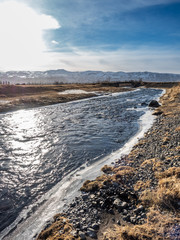 Frozen water in river near Gluggafoss, Iceland