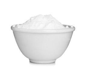 Bowl with baking soda on white background