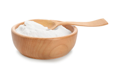 Wooden bowl with baking soda on white background