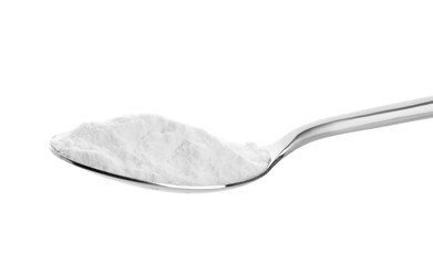 Spoon with baking soda on white background