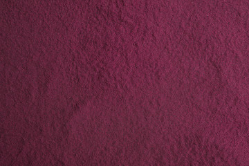 Acai powder as background, closeup