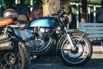 two classic style cafe racer motorcycle at sunset time. Bike custom made in vintage. Brutal fun urban lifestyle