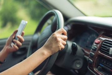 women driver with a cell phone