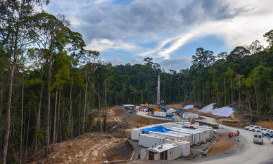 Drilling land rig in oil and gas exploration; location Borneo rain forest