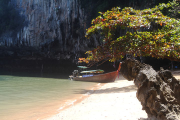 long tail boat stop at the beach for tourism service.