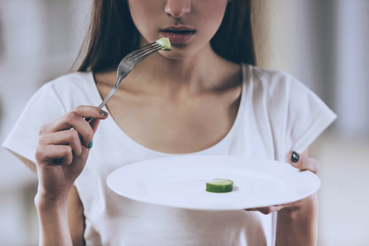 Young Thin Girl Eat Cucumber.