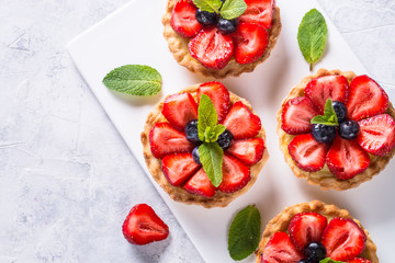 Strawberry tart on white.