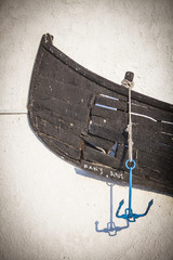 Wooden boat on a wall