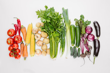 flat lay with fresh autumn vegetables arranged isolated on white