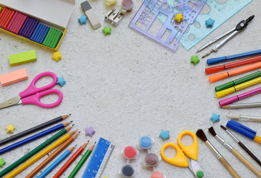 School accessories and supplies: pencils, markers, paint, pens, ruler on a light background. Back to school concept. Flat lay. Copy space
