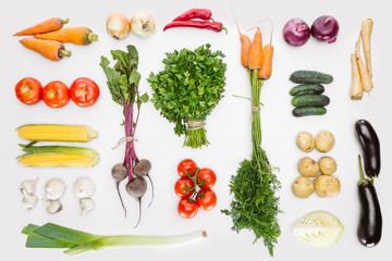 flat lay with fresh autumn vegetables arranged isolated on white