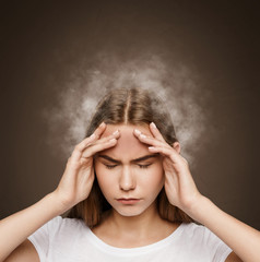 Girl holding head with steam coming from it