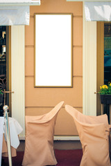 Mock up of signboard or bilboard on the wall near outdoor restaurant or cafe