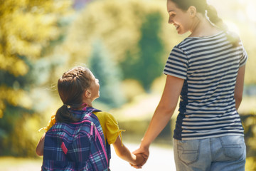 Parent and pupil go to school