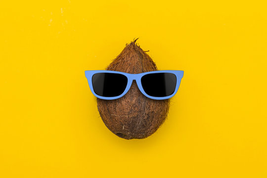 Tropical summer coconut with sunglasses