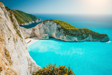 Navagio beach or Shipwreck bay panoramic. Turquoise sea water and white beach between huge cliffs. Famous landmark location on Zakynthos island, Greece