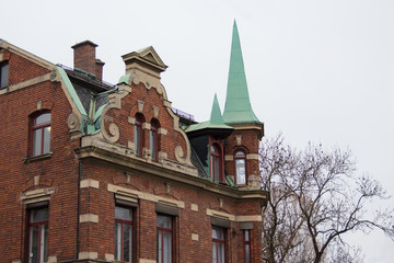Old rustic european brick wall building in Augsburg Germany in fall witch house with nice ornaments