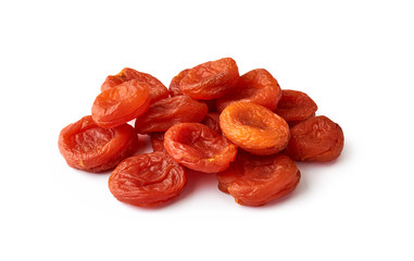 Heap of dried apricots isolated on white background. Fruit dried in the sun.