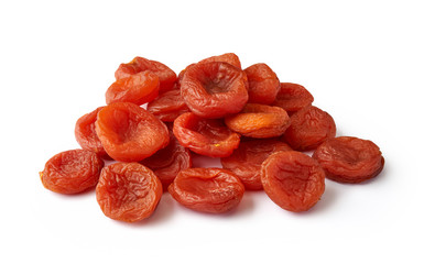 Heap of dried apricots isolated on white background. Fruit dried in the sun.