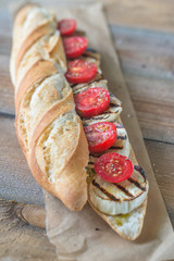Sandwich with grilled aubergines and cherry tomatoes