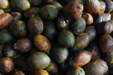 Areca nut aka betel nut at a market for sale. Paan is sold in ready-to-chew pouches called pan masala/ supari, as a mixture of many flavours whose primary base is areca nut crushed into small pieces