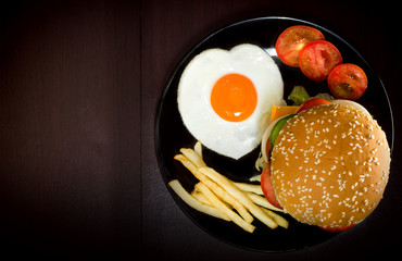 Hamburger with Egg Lettuce and Tomato.