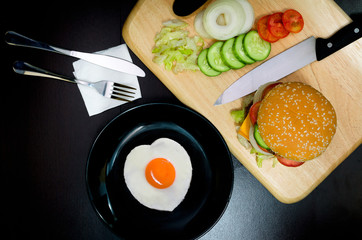 Hamburger with Egg Lettuce and Tomato.