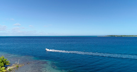 boat in a lagoon in French Polynesia, in aerial view