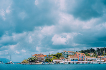 Fototapeta na wymiar Cloudscape over sea and Fiskardo village, Kefalonia Island Greece