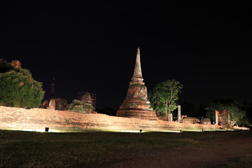 Night shot of incomplete small stupa in the ruins of ancient remains at Wat Mahathat temple, it...