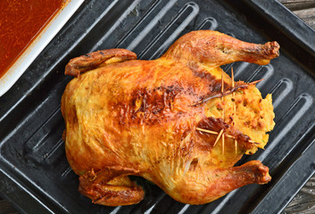 Stuffed roast chicken with bread crumbs wait gravy (German name is Gefülltes Brathuhn mit Semmelfülle)