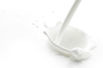 Fototapeta na wymiar Pouring milk splash