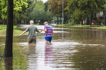Residents navigates hight flood waters
