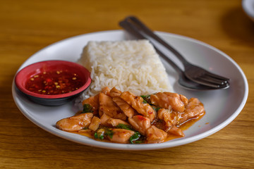 Stir Fried Salmon on the table with softlight