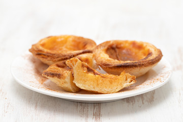 typical portuguese egg tart pastel de nata with cinnamon