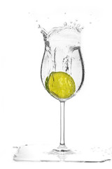 Slice of  the lime drop in glass cause  the splash