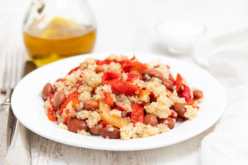 salad with quinoa on white plate on white background