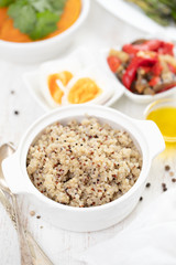 boiled quinoa and vegetables on white table