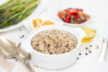 boiled quinoa and vegetables on white table