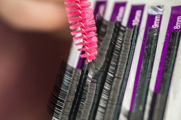 Artificial eyelashes and a brush for their subsequent combing