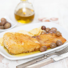 fried cod fish with olive oil on dish
