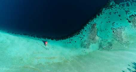 house on the water in the middle of a lagoon