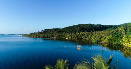 fishing boat in a tropical landscape, French Polynesia