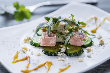 Salad with canned tuna, boiled egg and fresh cucumber.