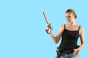 Young beautiful sexy blond Woman holding Handgun in hand